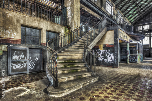 Imposing staircase inside the hall of an abandoned power plant