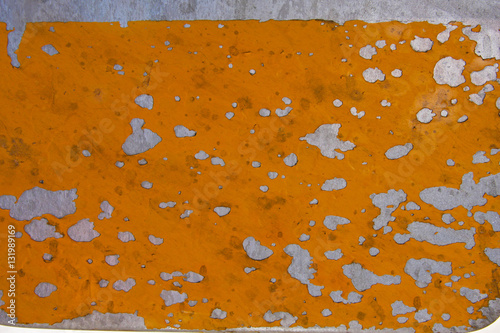 Pealing yellow paint on metal from the side of an old plane