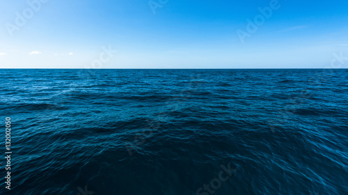 Dark deep ocean and blue sea, The vast sea with blue sky
