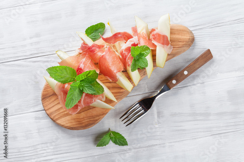 Fresh melon with prosciutto and mint