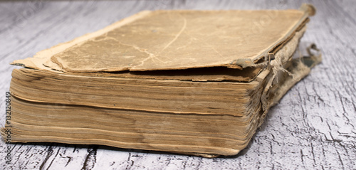 closedold book on a wooden background