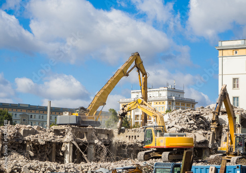 demolition on building site with excavator