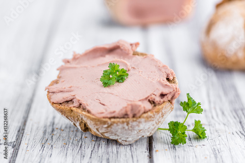 Wooden table with Liverwurst Sandwich (selective focus)