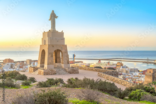 Statue of Christ staying above the Almeria city