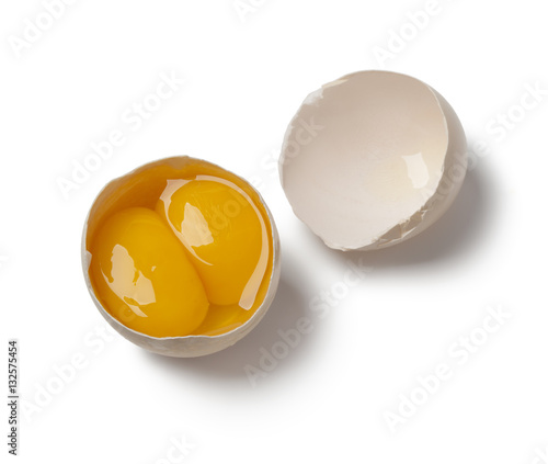  Broken double yolk egg in the shell