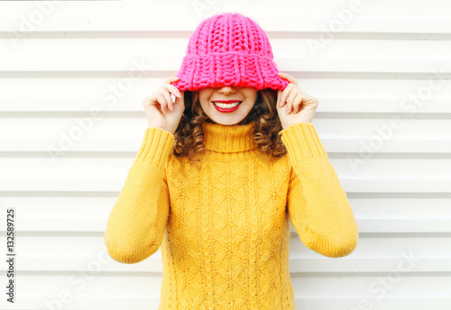 Fashion portrait happy young smiling woman wearing colorful pink