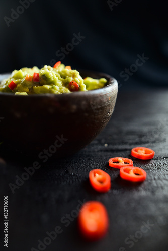 Bowl of guacamole with fresh ingredients