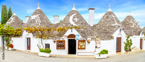 Streets of Alberobello town with Trulli houses in Apulia, Italy
