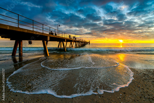 People on Glenelg Beach jetty