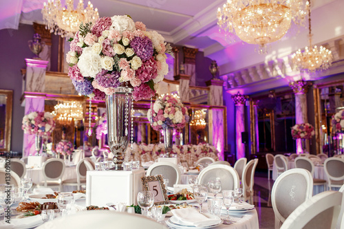 Table number 5 decorated with pink and violet hydrangeas and ser