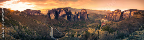 Breathtaking panoramic view of Meteora at sunset, Greece. Geological formations of big rocks with Monasteries on top of them.