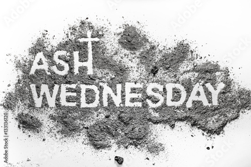 Ash wednesday word written in ash and christian cross symbol