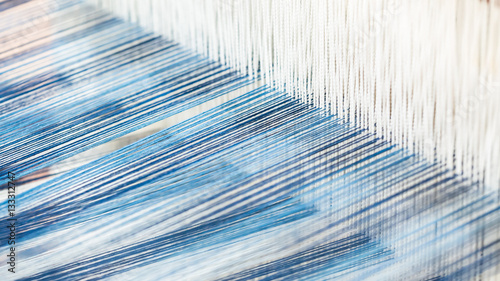 Closeup, abstract motion blur of silk fabric weaving