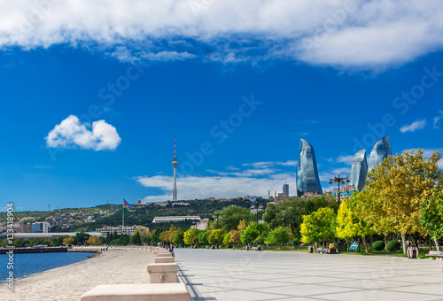 Flame towers in Baku cityscape.