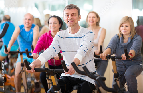 Man on fitness cycle training