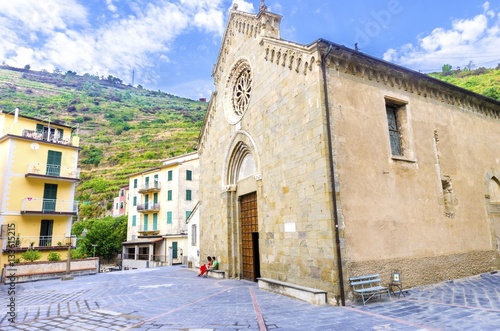 Manarola town, Riomaggiore, La Spezia province, Liguria, northern Italy. The San Lorenzo church facade, monument landmark. Part of the Cinque Terre National Park and a UNESCO World Heritage Site.