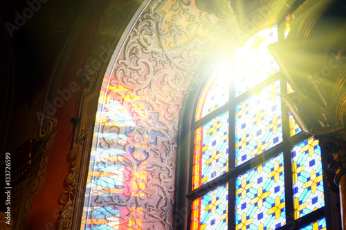 The Bernardine church and monastery (church of St. Andrew) in Lviv, Ukraine. Church and fortification was built in 1600-1630. Beautiful stained glass window with sunlight. Religion and art concept.