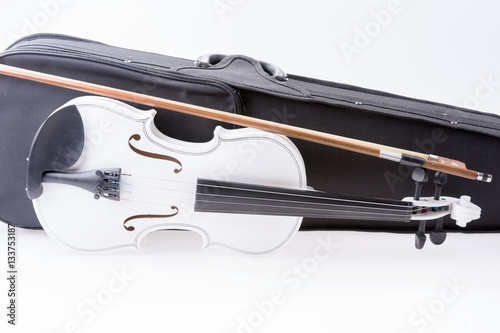 White violin with the bow isolated on white background
