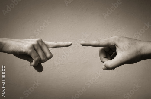 Fingers pointing at each other. People arguing and fighting concept. 