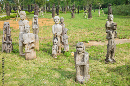 The wooden statue (woman, man, kid) on the tombs of the Central Highlands, Vietnam is (object mastaba tombs) typical known of the ethnic culture of this place