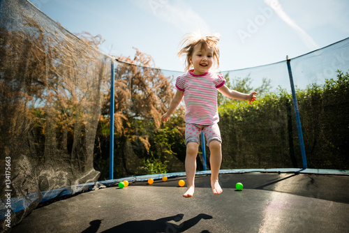 Child jumping trampoline