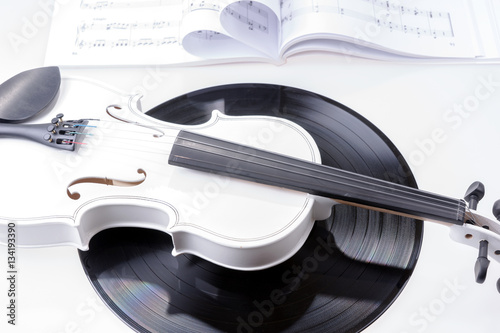 White violin and black record isolated on white background