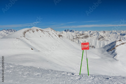 Stop sign on the ski slopes