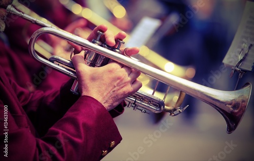 trumpeter plays his trumpet in the brass band