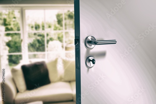 Composite image of closeup of metal doorknob and lock with key