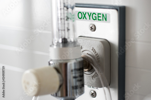 O2 Pressure gauge for measured control of oxygen to a patient in an emergency used in hospital equipment plugged into the wall with clear glass valve