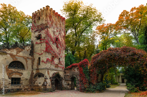 Arkadia, Poland - September 30, 2016: Burgrave's house and stone arch in the sentimental and romantic Arkadia park, near Nieborow, Central Poland, Mazovia. Garden in the English style