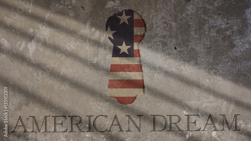 American Dream Written on a Concrete Wall. Keyhole and Flag