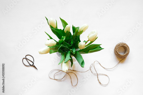 Bouquet of white tulips and accessories