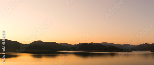 landscape view - sky,mountain and dam in evening time
