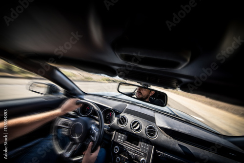 Man driving his sport car