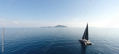 Amazing view to Yacht sailing in open sea at windy day. Drone view - birds eye angle. - Boost up color Processing.