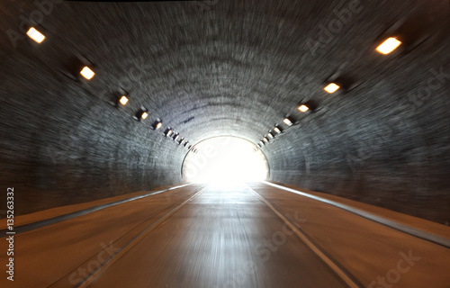defocused photo on light at the end of tunnel