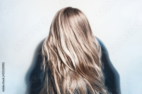 Healthy dyed blond hair of young woman