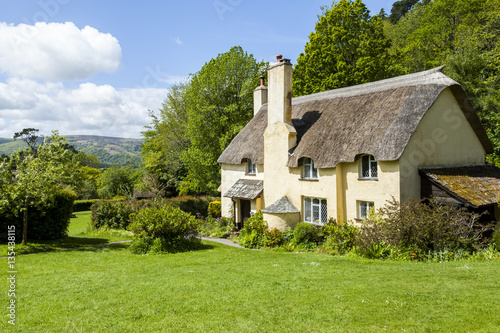 Thatched roof cottage in a typical English village.