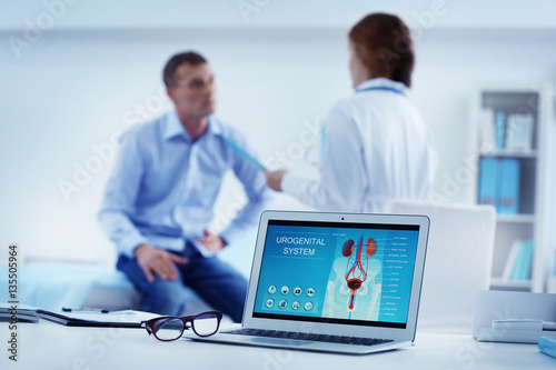 Medical concept. Laptop with urology image on doctor's desk