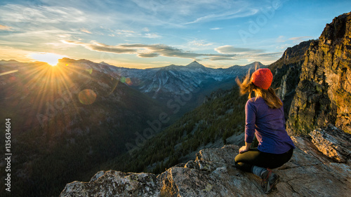 A hiker watches sunset over the Bitteroots from Bear Creek Overlook in the Selway-Bitterroot Wilderness.