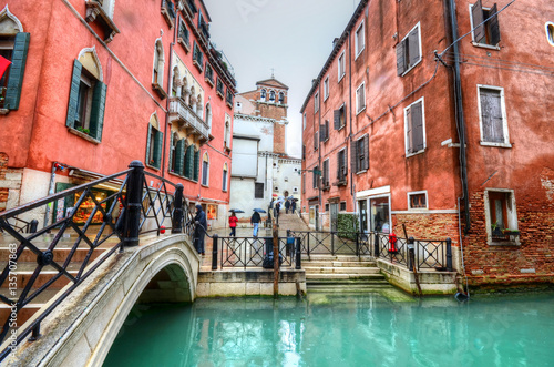 Traditional bridge and house architecture near the canal in Venice, Italy