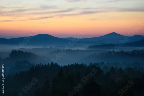 Sunrise in Bohemian Switzerland with typical foggy atmosphere, Czech republic