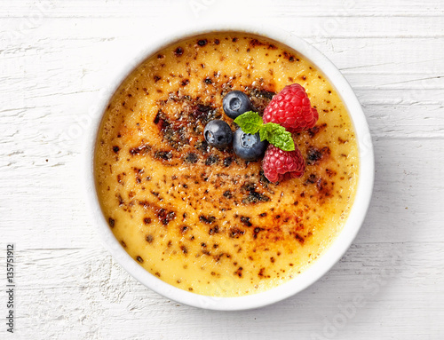 bowl of creme brule on white wooden table