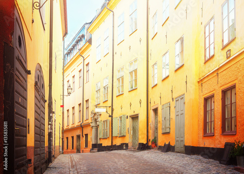 view of old town street in Stockholm at sunny day, Sweden, retro toned
