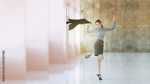 Business women : Asian women people young business women standing enjoy and jump, The beautiful model business woman hold suit and smiling, space brown wall background