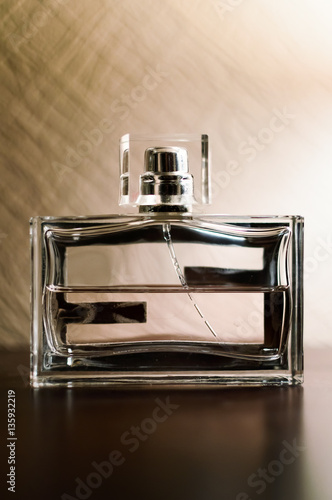 Men's perfume in a glass container.