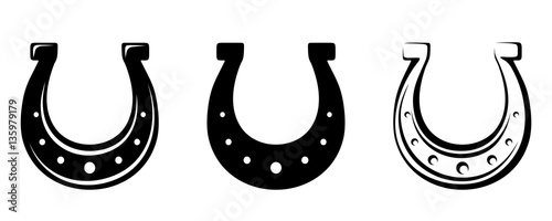 Set of three vector black silhouettes of horseshoes isolated on a white background.