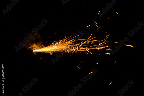 Burning fuse on black background