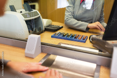 clerk counting cash money at bank office